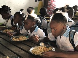 Table of children eating HaitiChildren