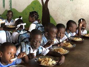Table of children eating HaitiChildren